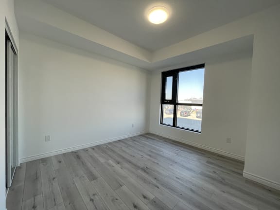 Bayfield Tower Apartments 2 bedroom 1 bathroom variation B bedroom with large window