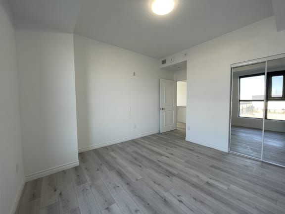 Bayfield Tower Apartments 2 bedroom 1 bathroom variation B second bedroom with sliding mirror closet doors