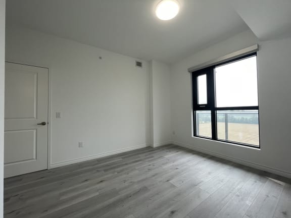 Bayfield Tower Apartments 2 bedroom 2 bathroom variation A primary bedroom with large window