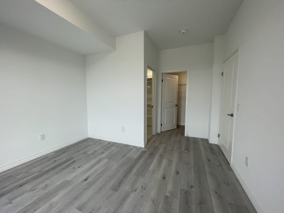 Bayfield Tower 2 bedroom 2 bathroom variation A primary bedroom with ensuite bathroom seen in the background