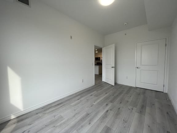 Bayfield Tower Apartments 2 bedroom 2 bathroom variation A second bedroom with closet door seen in background