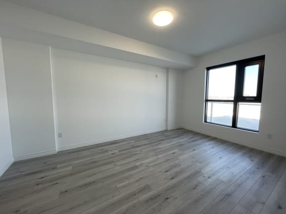 Bayfield Tower 2 bedroom 2 bathroom variation B primary bedroom with a large window