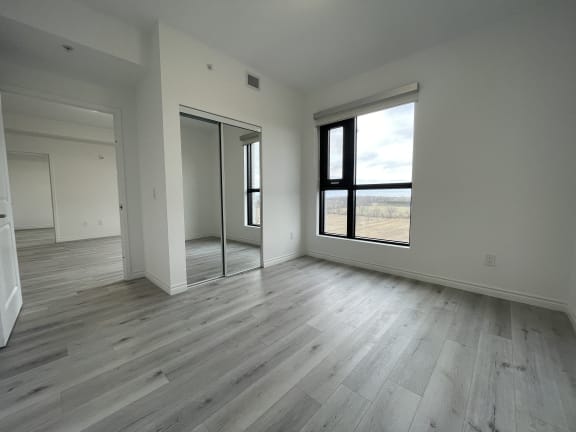 Bayfield Tower Apartments 3 bedroom 2 bathroom variation A third bedroom with large window and double sliding mirror closet
