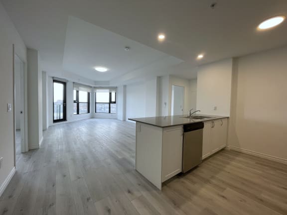 Bayfield Tower Apartments 2 bedroom 2 bathroom variation D open-concept kitchen and living room as seen from the entryway