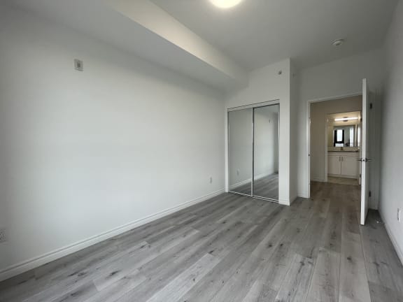 Bayfield Tower Apartments 2 bedroom 2 bathroom variation D second bedroom with double sliding mirror closet doors
