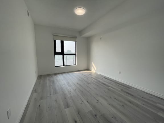 Bayfield Tower 2 bedroom 2 bathroom variation E second bedroom with a large window