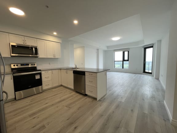 Bayfield Tower Apartments 3 bedroom 2 bathroom variation B open-concept kitchen and living room