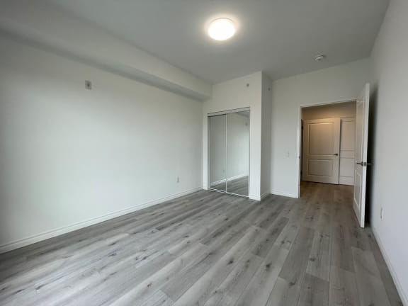 Bayfield Tower Apartments 3 bedroom 2 bathroom variation B primary bedroom with double mirrored closet