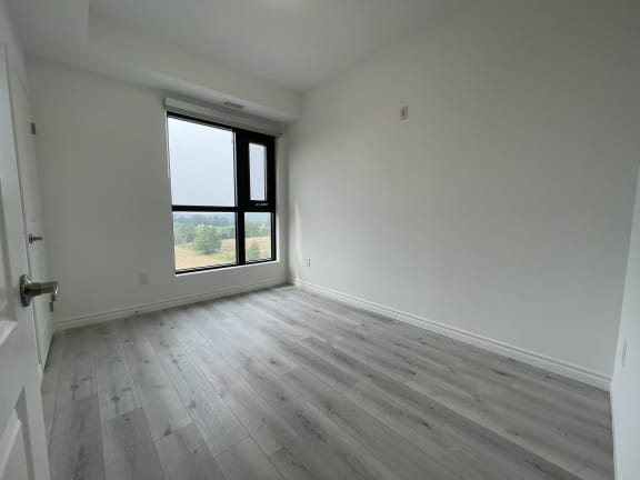 Bayfield Tower Apartments 3 bedroom 2 bathroom variation B second bedroom with large window