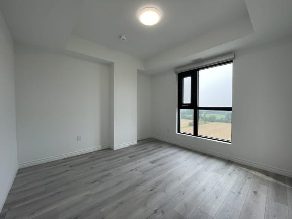 Bayfield Tower Apartments 3 bedroom 2 bathroom variation B third bedroom with a large window