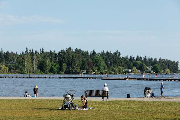 A family enjoys a day at the park by the water.