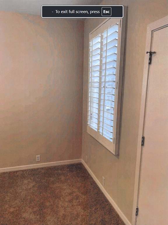 A room with a window and a door.