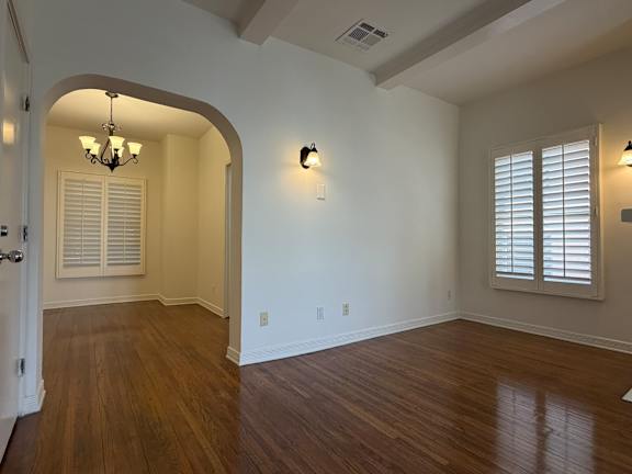 A room with wooden floors and white walls.