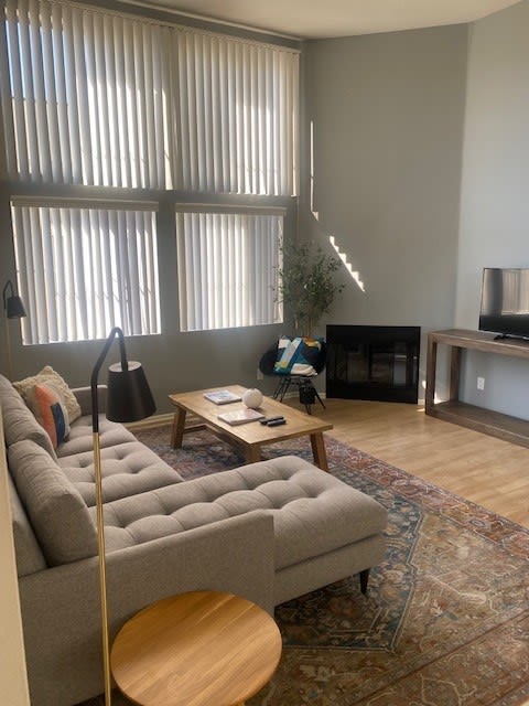 a living room with a couch and a tv