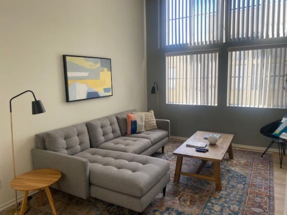 a living room with a couch and a table