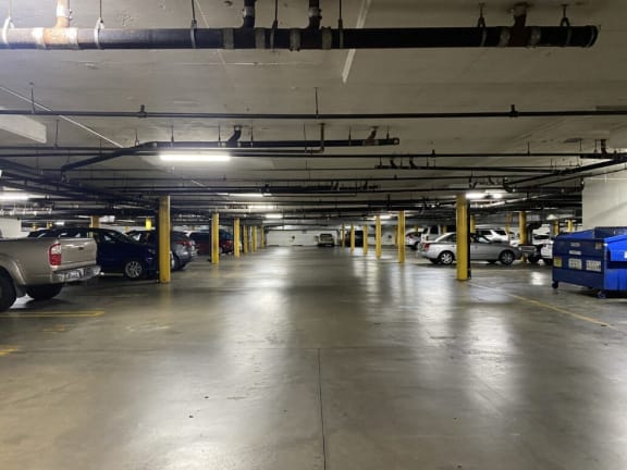 a parking garage with cars parked in it