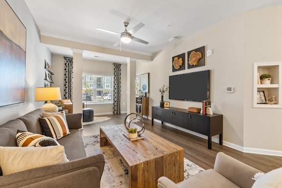 a living room with couches and a tv