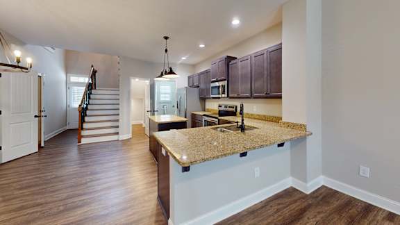 a kitchen with a granite counter top and a sink