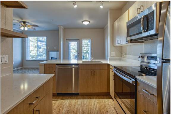 Kitchen with wooden cabinetry at Wilsonville Summit Apartments, Wilsonville , Oregon