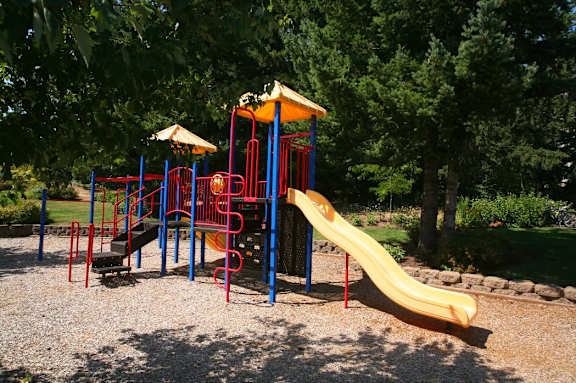 Playground with yellow slide at Wilsonville Summit Apartments, Wilsonville , 97070