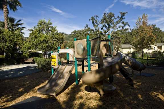 a playground with slides at a park