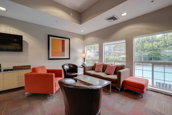 a living room with couches and chairs and a coffee table