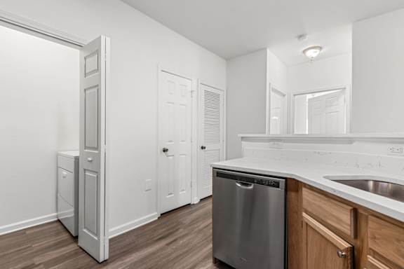 A kitchen with a dishwasher and a sink.