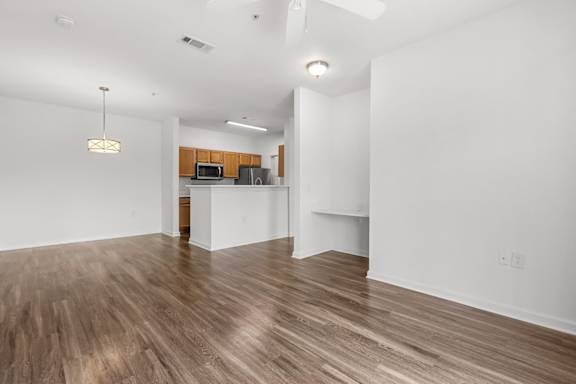A room with wooden floors and white walls.