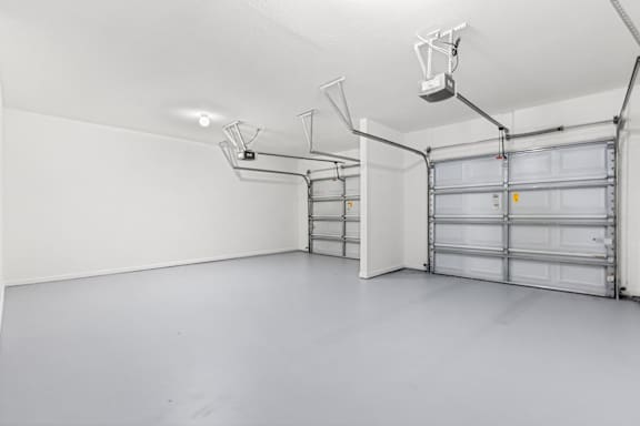 A garage with a white wall and a white ceiling.