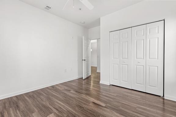 A room with a white door and a white wall.