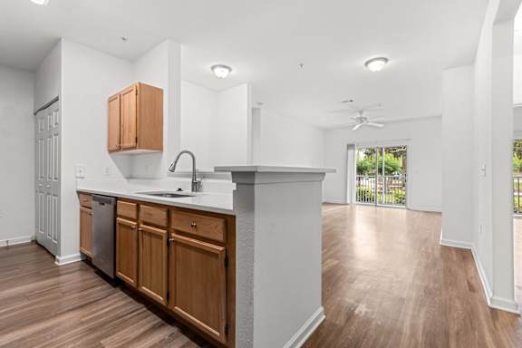 A kitchen with wooden cabinets and a white countertop.