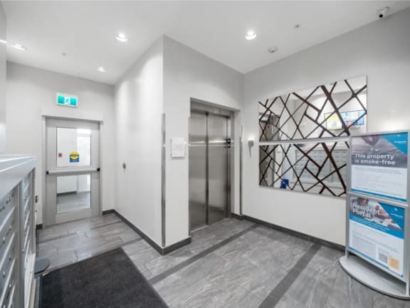 A hallway with a sign that says