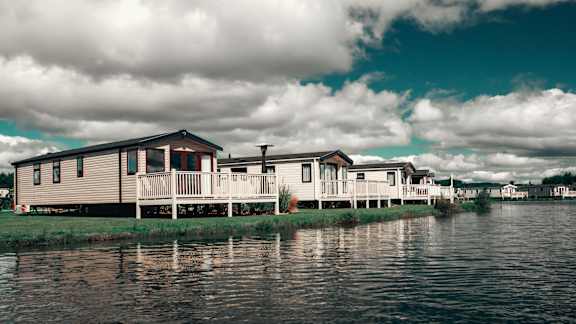 Floor Plan  A house is built on stilts over a body of water.
