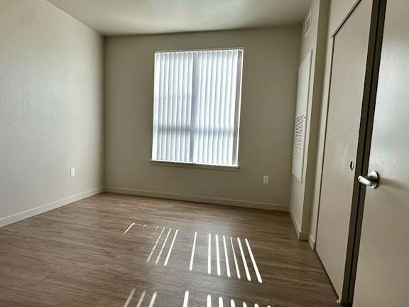 Bedroom With window at All Saints Apartments, DENVER, Colorado