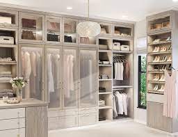 a large walk in closet with lots of closets