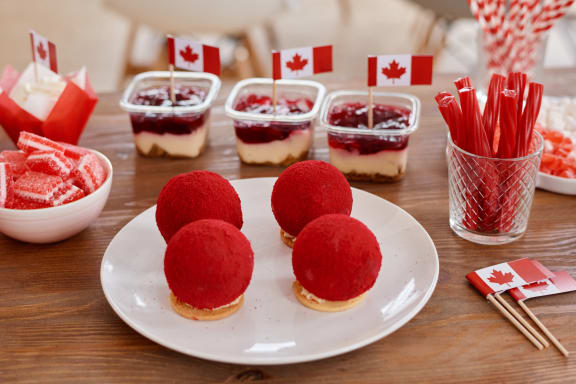 a plate of desserts on a table with flags of canada