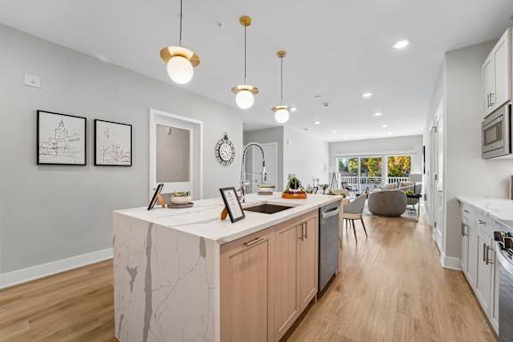 Kitchen island has built in trash cabinet