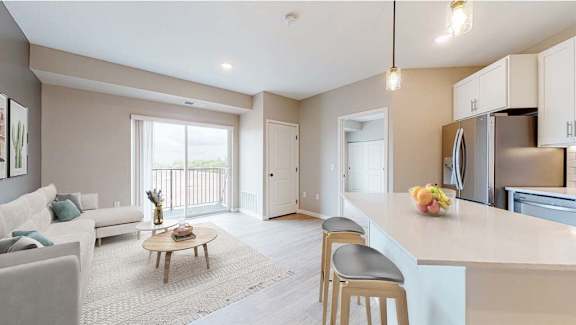 A modern kitchen with a breakfast table and chairs.
