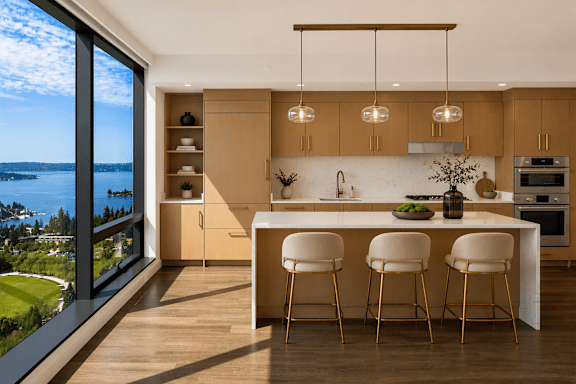 A modern kitchen with a view of the lake.