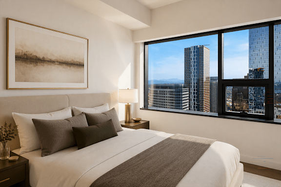 A bedroom with a large bed and a view of the city.