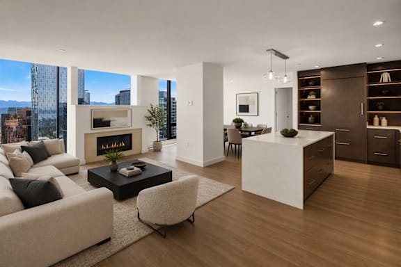 A modern living room with a fireplace and a dining area.