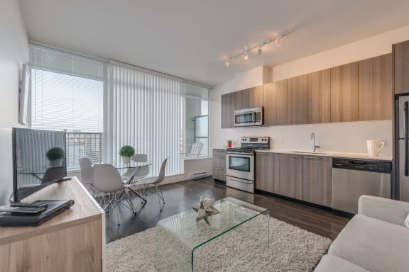 a kitchen and dining area in a 555 waverly unit
