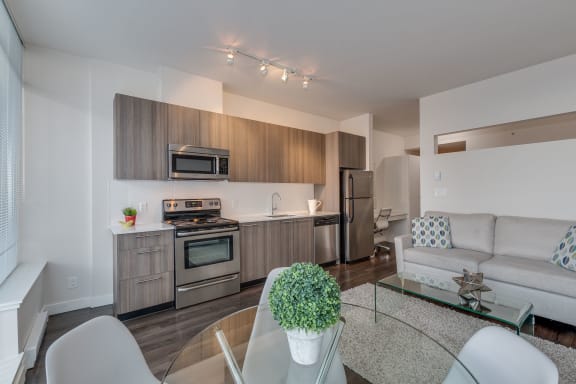 a kitchen and living room in a 555 waverly unit