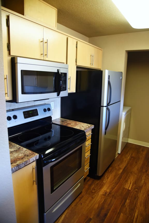 refrigerator and stovetop at Graymayre Crossing Apartments, Spokane