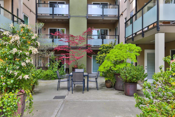 Courtyard Patio With Ample Sitting at Charbonneau, Seattle