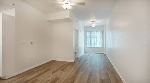 A room with wooden floors and white walls.