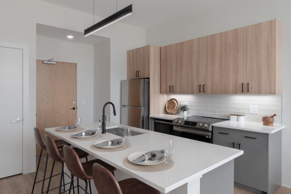 a kitchen with a large island at Breakwater Lofts, Cleveland, Ohio
