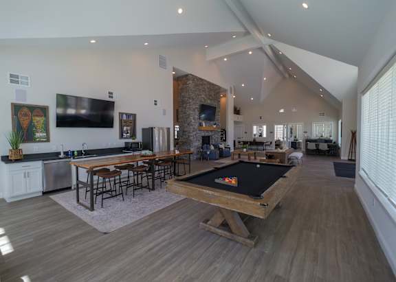 a large living room with a pool table and a television at The Bend, Lancaster
