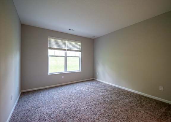 an empty room with carpet and a window at The Bend, Ohio, 43130