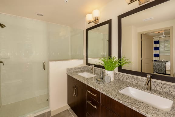 a bathroom with two sinks and a walk in shower at Azura, Miami, Florida